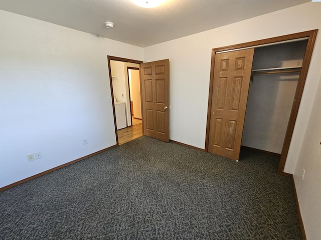 1135-1137 NE Indiana St, Pullman, WA 99163 - unfurnished bedroom featuring baseboards, a closet, and dark colored carpet
