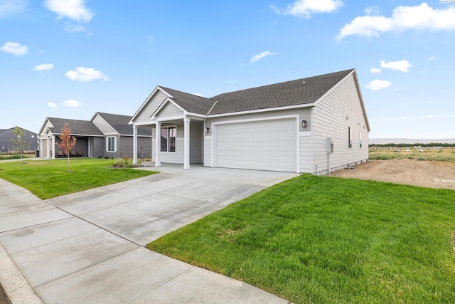 view of front facade with a garage and a front yard