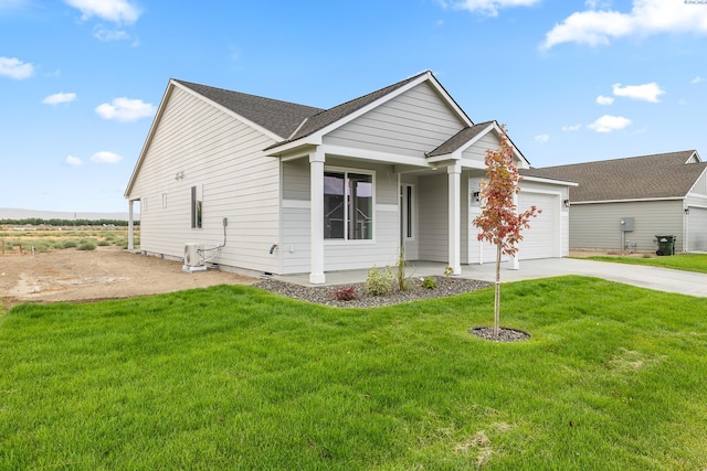 view of front of property featuring a garage and a front yard