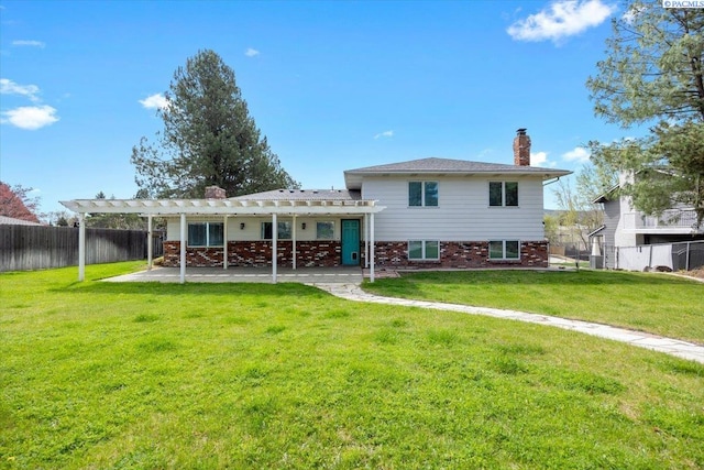 rear view of house with a chimney, a fenced backyard, a yard, a patio, and a pergola