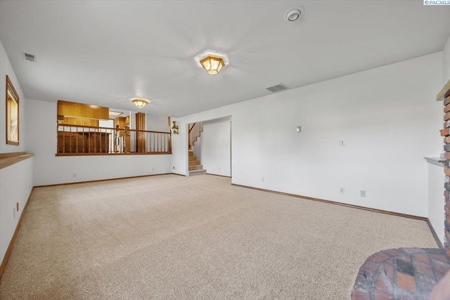 1110 W 22nd Ave, Kennewick, WA 99337 - unfurnished living room with carpet floors, stairway, and baseboards
