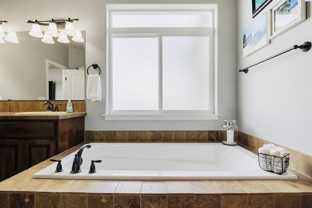 full bathroom featuring a garden tub and vanity