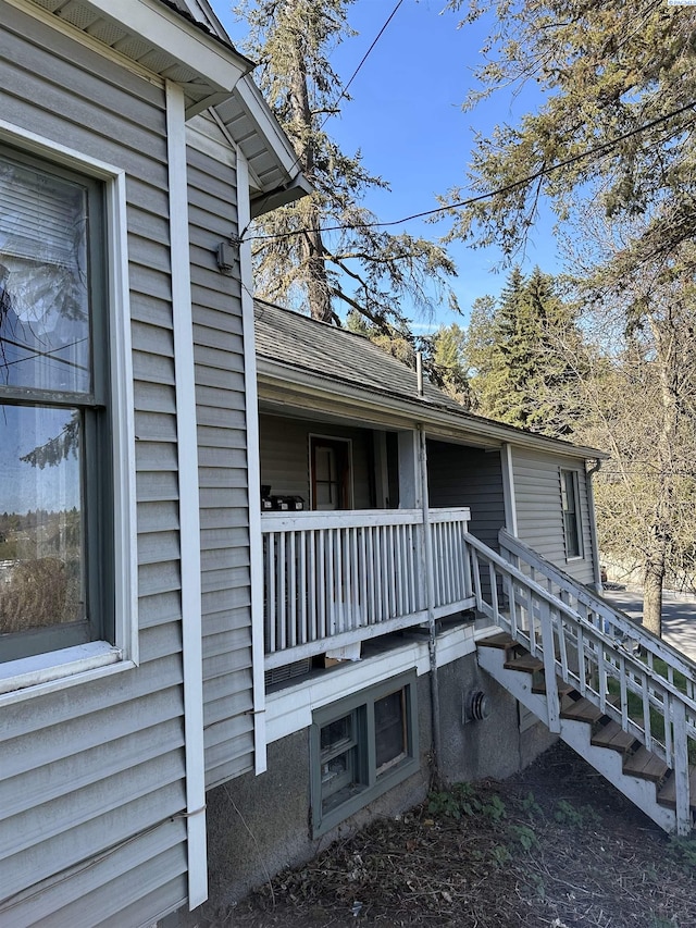 view of home's exterior featuring roof with shingles