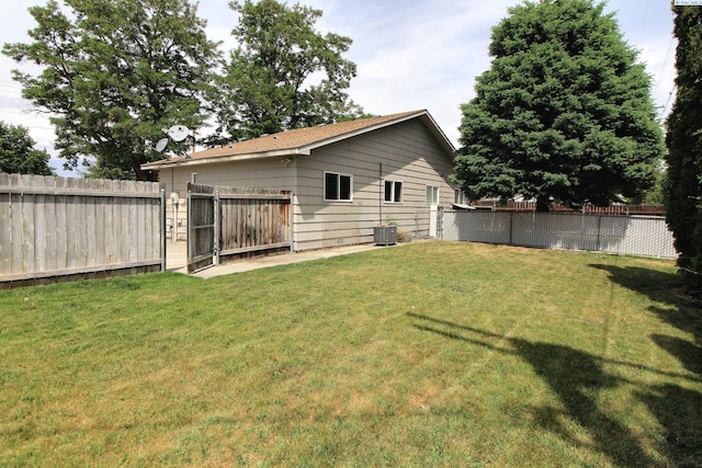 view of yard with a fenced backyard