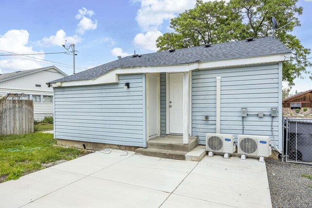 1517 Perkins Ave, Richland, WA 99354 - rear view of house with a cooling unit, a shingled roof, and a patio area