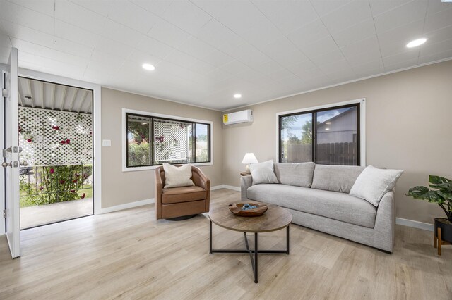 1517 Perkins Ave, Richland, WA 99354 - living area featuring light wood finished floors, baseboards, a wall mounted air conditioner, and recessed lighting
