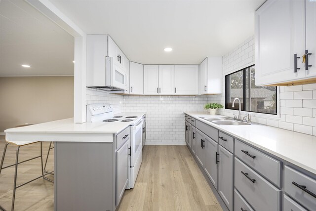 1517 Perkins Ave, Richland, WA 99354 - kitchen featuring gray cabinetry, white appliances, and a sink
