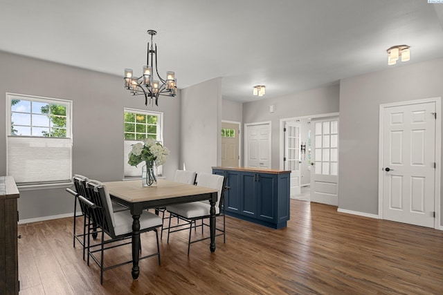 19 Ivy Ln, Pasco, WA 99301 - dining space with dark wood-type flooring and a chandelier
