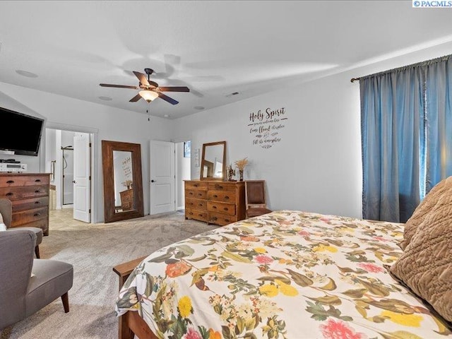 bedroom featuring ceiling fan and light carpet