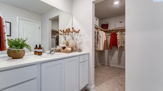 611 S Zeelar St, Kennewick, WA 99336 - bathroom with vanity and a spacious closet