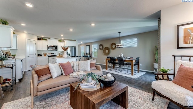 611 S Zeelar St, Kennewick, WA 99336 - living room with dark wood-style flooring, recessed lighting, and an office area