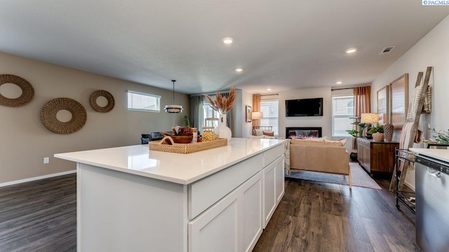611 S Zeelar St, Kennewick, WA 99336 - kitchen with dishwasher, dark wood-style floors, white cabinets, light countertops, and recessed lighting