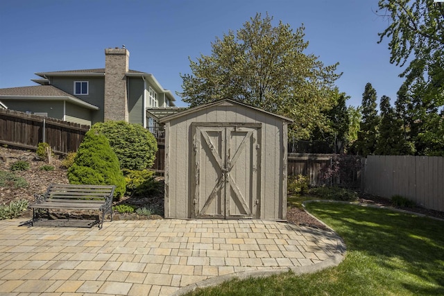 view of shed with a fenced backyard