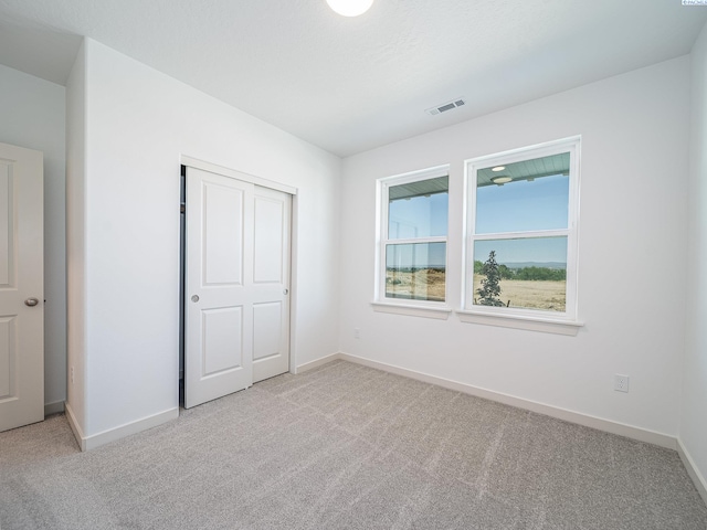 1580 SW Kelandren Dr, Prosser, WA 99350 - unfurnished bedroom with baseboards, light colored carpet, and visible vents