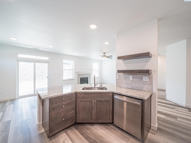 1580 SW Kelandren Dr, Prosser, WA 99350 - kitchen with open shelves, ceiling fan, a sink, light wood-style flooring, and stainless steel dishwasher