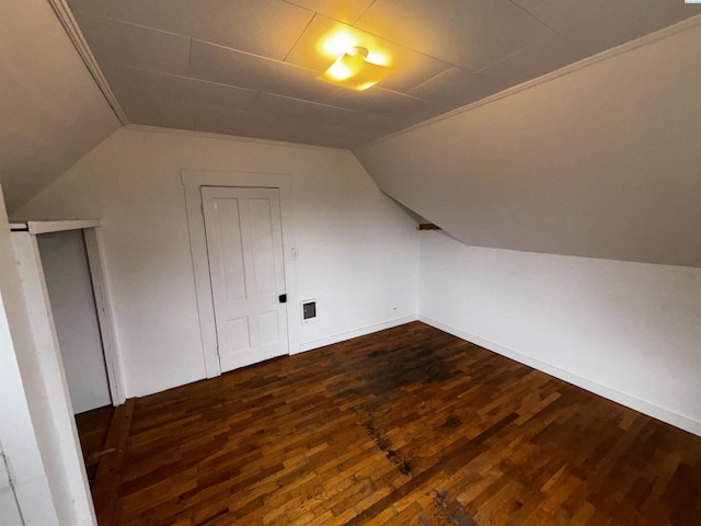 320 SE High St, Pullman, WA 99163 - additional living space with baseboards, dark wood-style flooring, visible vents, and vaulted ceiling