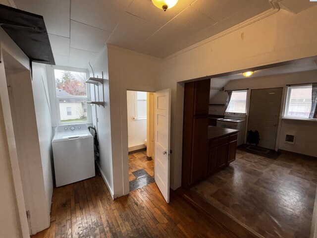 320 SE High St, Pullman, WA 99163 - laundry room with baseboards, washer / clothes dryer, ornamental molding, laundry area, and dark wood-type flooring