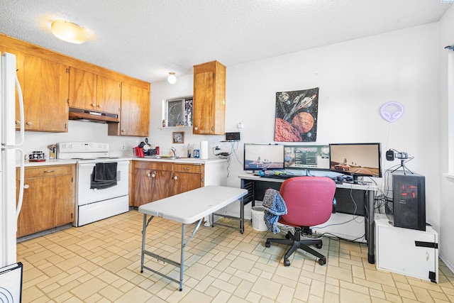 1430 NW Deane St, Pullman, WA 99163 - kitchen featuring white appliances, under cabinet range hood, brick patterned floors, light countertops, and an office area