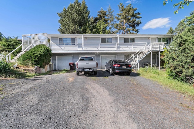 1430 NW Deane St, Pullman, WA 99163 - townhome / multi-family property featuring stairway, driveway, and a garage