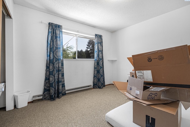 1430 NW Deane St, Pullman, WA 99163 - carpeted office featuring a baseboard heating unit and a textured ceiling