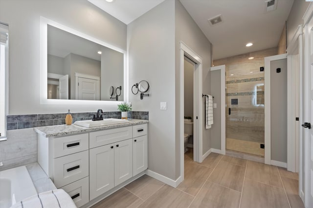 1120 S Kansas Pl, Kennewick, WA 99338 - full bath featuring vanity, a shower stall, toilet, and visible vents