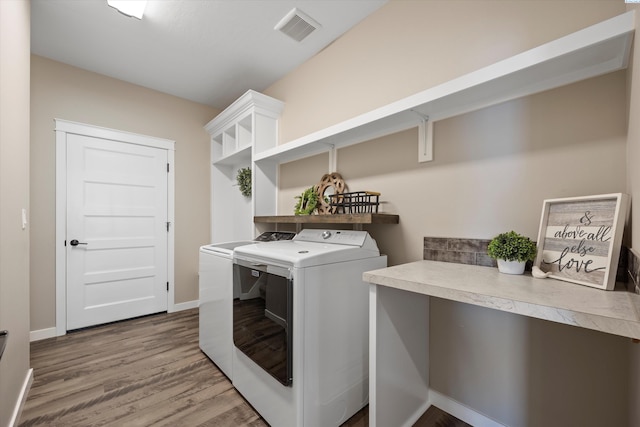 1120 S Kansas Pl, Kennewick, WA 99338 - laundry area featuring laundry area, visible vents, wood finished floors, washer and dryer, and baseboards