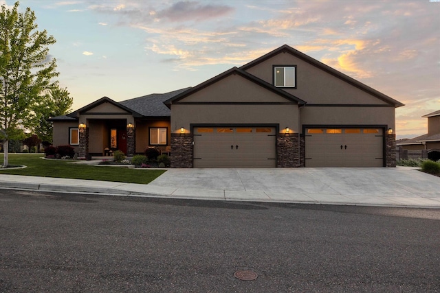 1120 S Kansas Pl, Kennewick, WA 99338 - craftsman inspired home with concrete driveway, a garage, stone siding, and stucco siding