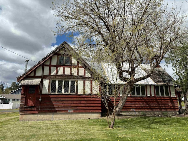 rear view of house with a lawn