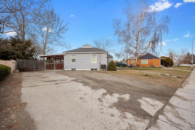 view of side of property featuring a carport