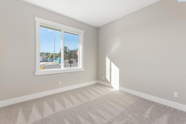 empty room featuring light colored carpet