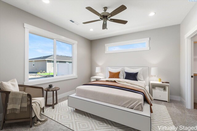 carpeted bedroom featuring ceiling fan