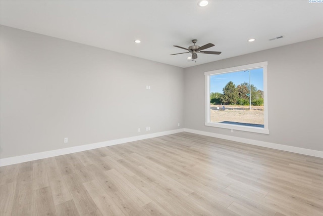 unfurnished room featuring ceiling fan and light hardwood / wood-style flooring