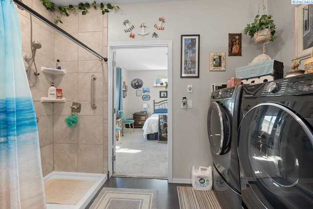 laundry room featuring laundry area, washer and clothes dryer, and baseboards