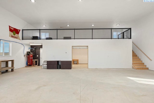 garage with recessed lighting and water heater