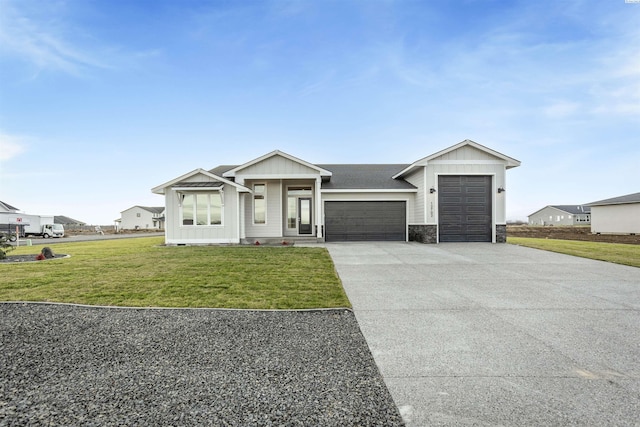 single story home featuring a garage and a front yard