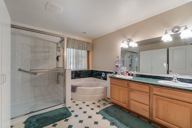 704 W 18th Ct, Kennewick, WA 99337 - full bath featuring a garden tub, double vanity, a shower stall, and tile patterned floors