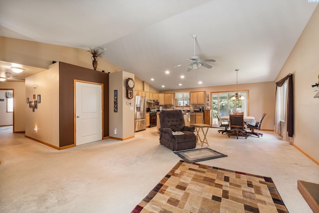704 W 18th Ct, Kennewick, WA 99337 - living room featuring vaulted ceiling, ceiling fan, baseboards, and light carpet