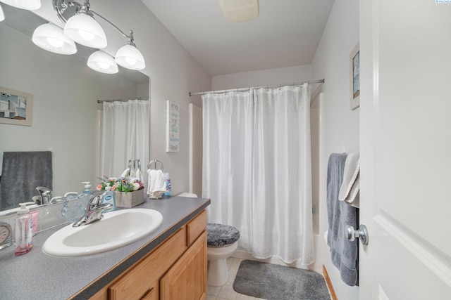 704 W 18th Ct, Kennewick, WA 99337 - bathroom with vanity, toilet, tile patterned floors, and shower / tub combo with curtain
