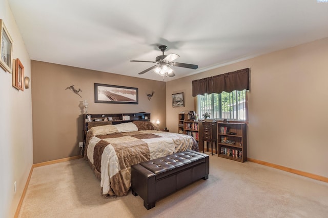 704 W 18th Ct, Kennewick, WA 99337 - bedroom with light colored carpet, baseboards, and ceiling fan