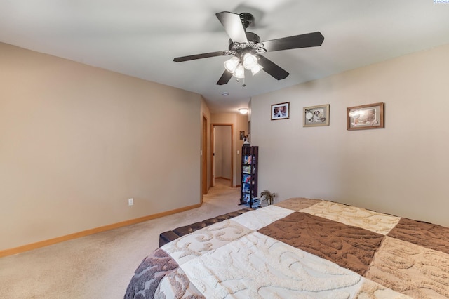 704 W 18th Ct, Kennewick, WA 99337 - bedroom with light carpet, baseboards, and a ceiling fan