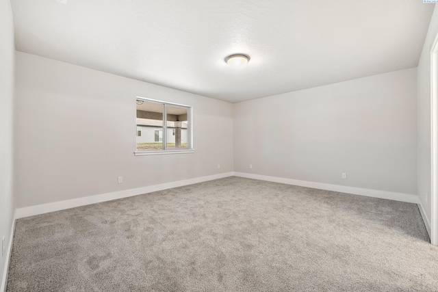 10709 Kokanee Dr, Pasco, WA 99301 - empty room featuring carpet floors and baseboards
