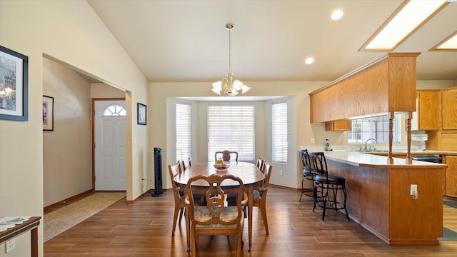 4318 Desert Pl, Pasco, WA 99301 - dining space featuring lofted ceiling, dark wood finished floors, healthy amount of natural light, a chandelier, and recessed lighting