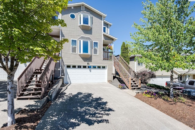 2349 NW Ridgeline Dr, Pullman, WA 99163 - view of front of property with stairs, concrete driveway, and a garage