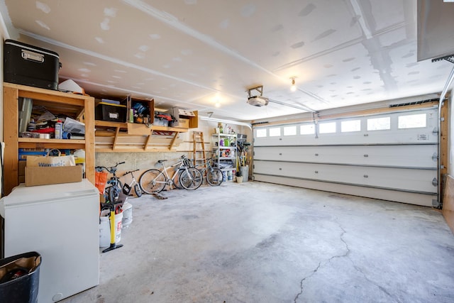 2349 NW Ridgeline Dr, Pullman, WA 99163 - garage featuring a garage door opener and white refrigerator