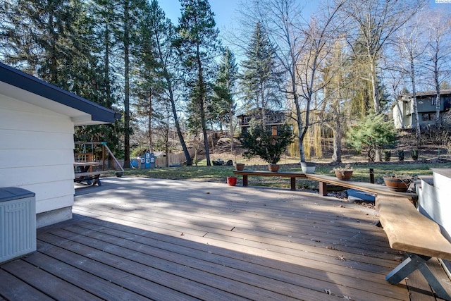 wooden terrace with an outbuilding and a shed