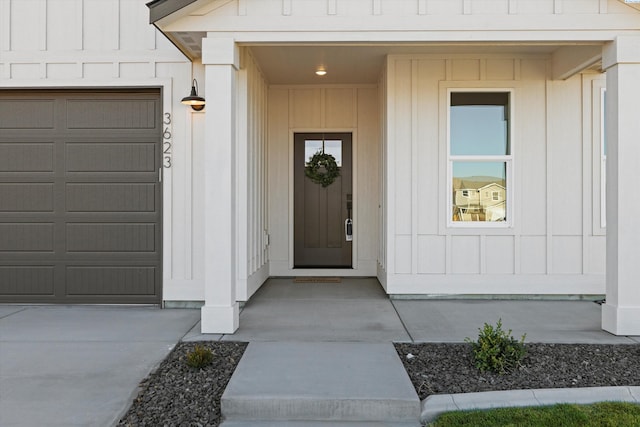 doorway to property with a garage