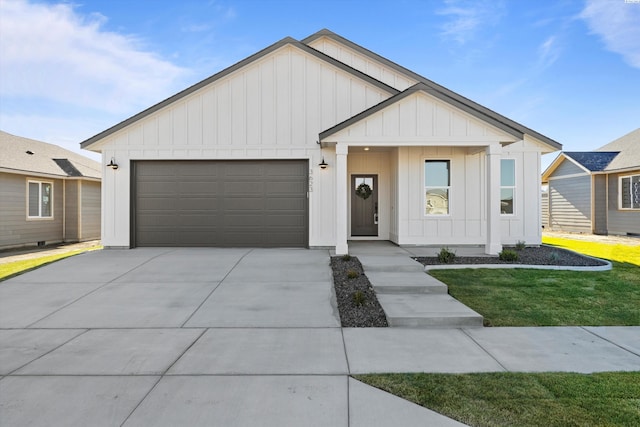 view of front of home featuring a garage and a front lawn