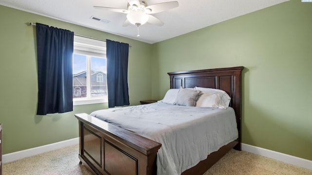 bedroom with baseboards, visible vents, and carpet floors