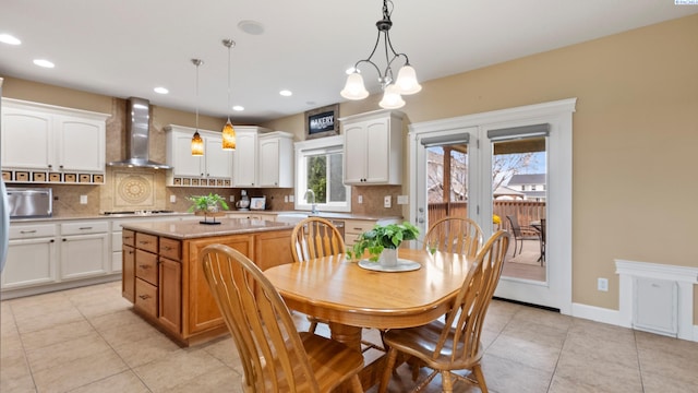 dining room featuring a notable chandelier, light tile patterned floors, recessed lighting, and baseboards