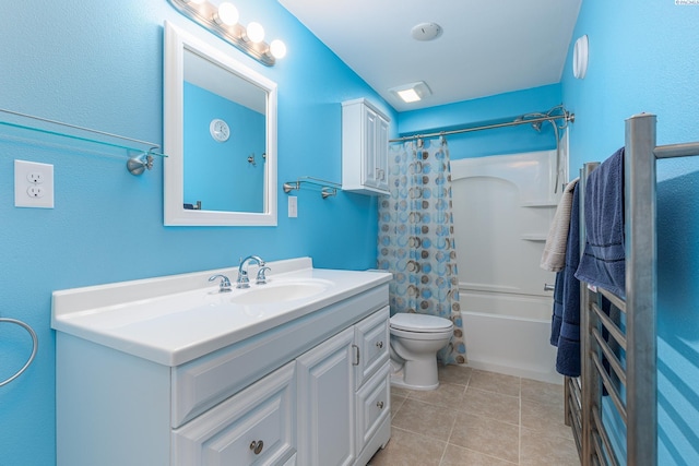 full bathroom with shower / bath combo, vanity, toilet, and tile patterned floors